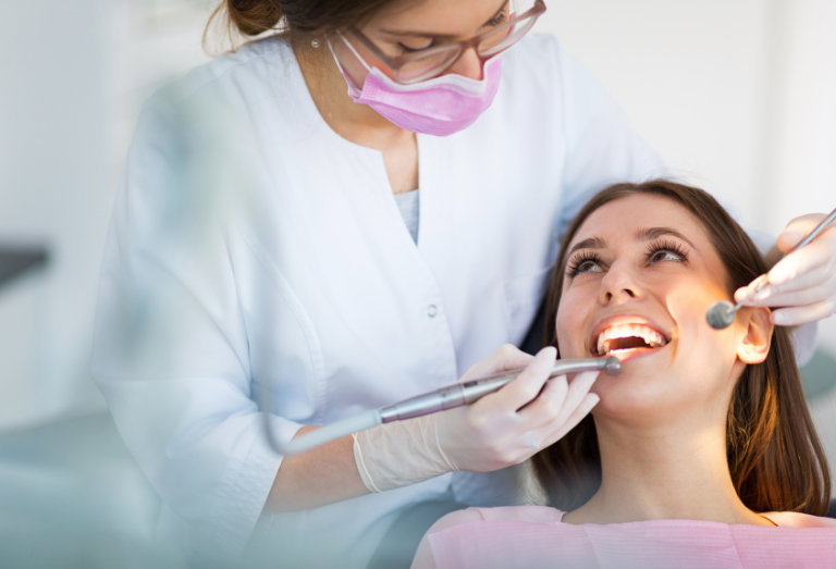 Dentist Performing a Dental Checkup on a Patient with Dental Tools in a Modern Clinic